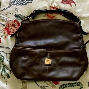 This is a Dooney & Bourke Dillen dark brown pebble leather shoulder bag